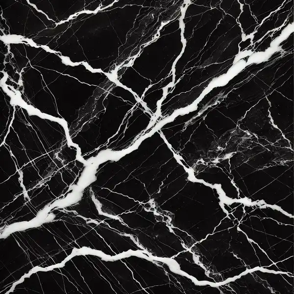 A close up view of Nero Marquina marble featuring a deep black background with striking white veins running through it